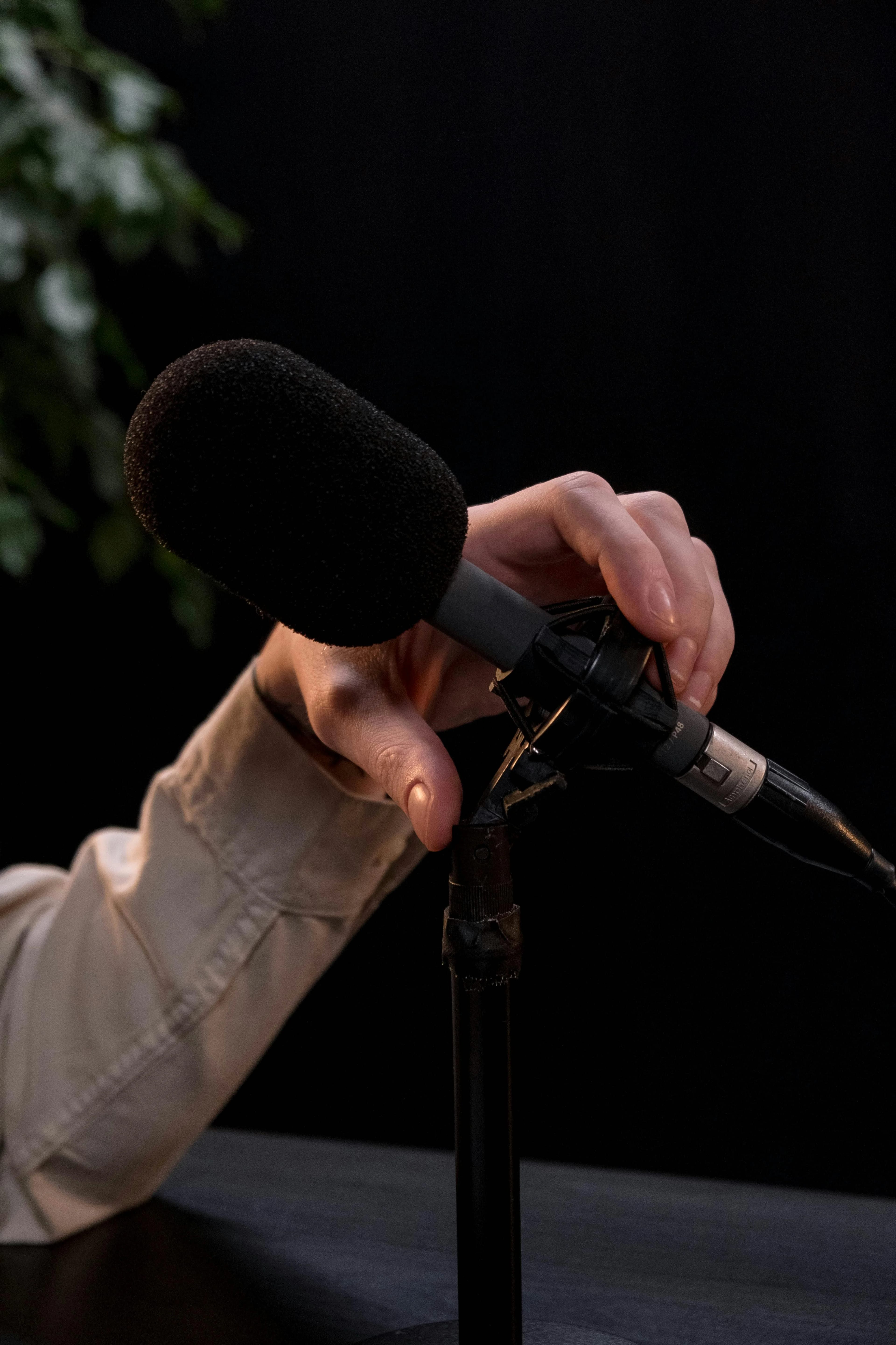 Microphone being adjusted mid-podcast episode